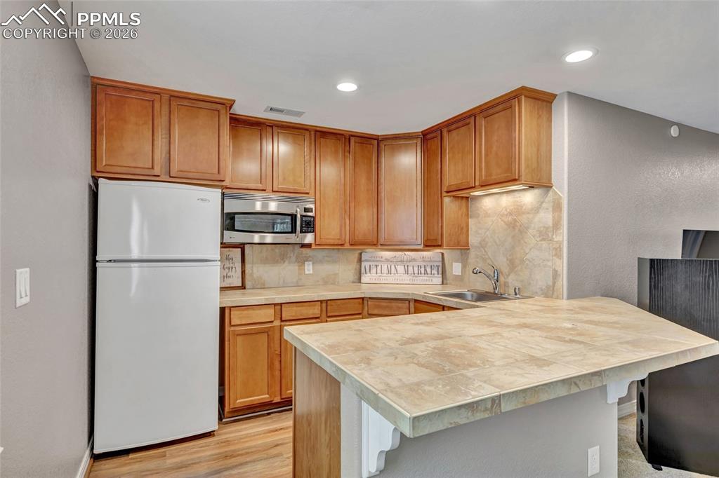 Image 31 of 48: Small Kitchen on Lower Level