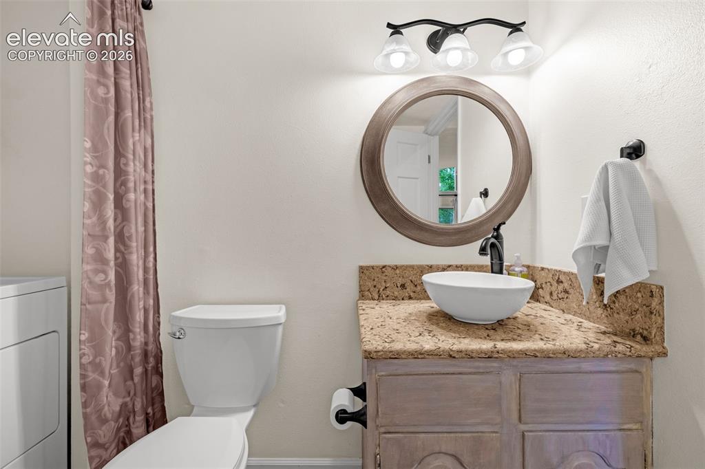 Image 33 of 43: Main level powder room