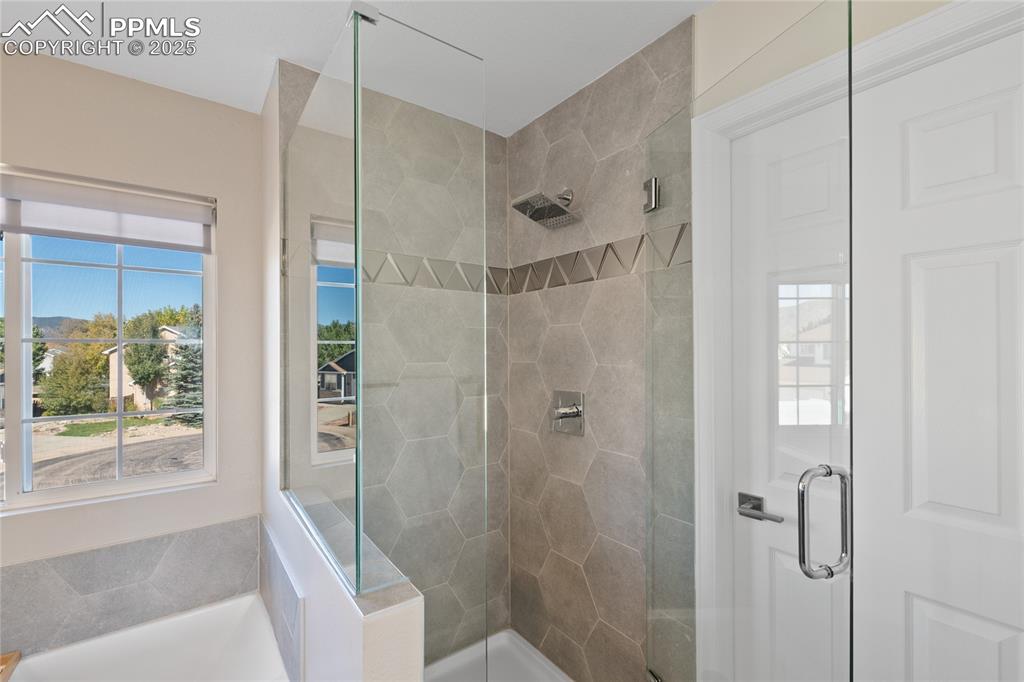 Image 35 of 47: Bathroom with a stall shower