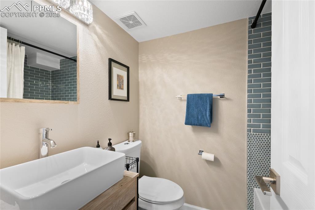 Image 38 of 47: Bathroom featuring toilet and vanity