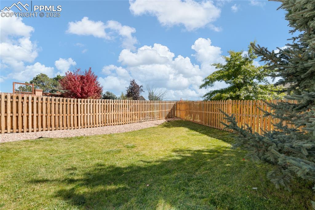 Image 45 of 47: View of fenced backyard