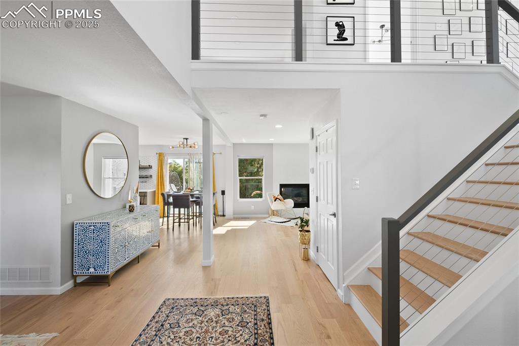Image 7 of 47: Entryway featuring light wood-style flooring, a chandelier, and recessed li