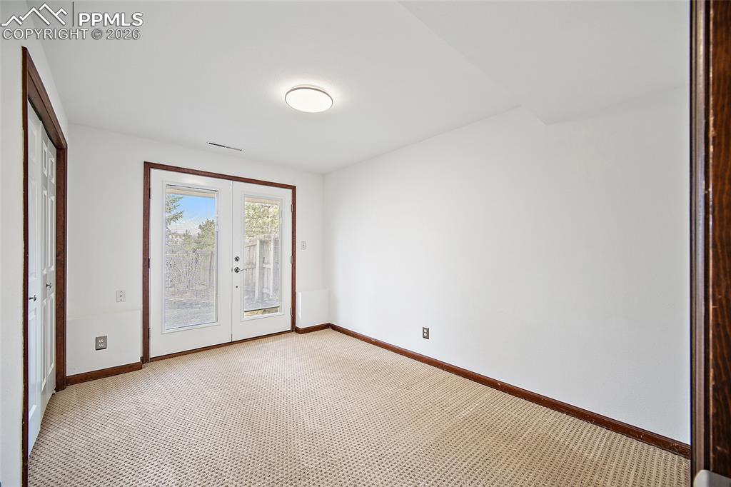 Image 32 of 50: Walkout to the backyard, bedroom 1 downstairs