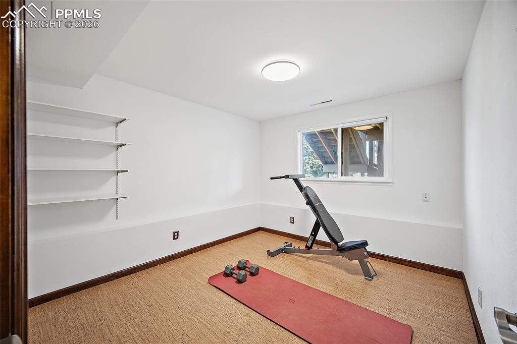 Image 35 of 50: bedroom, studio, office, workout room w/ cork floor