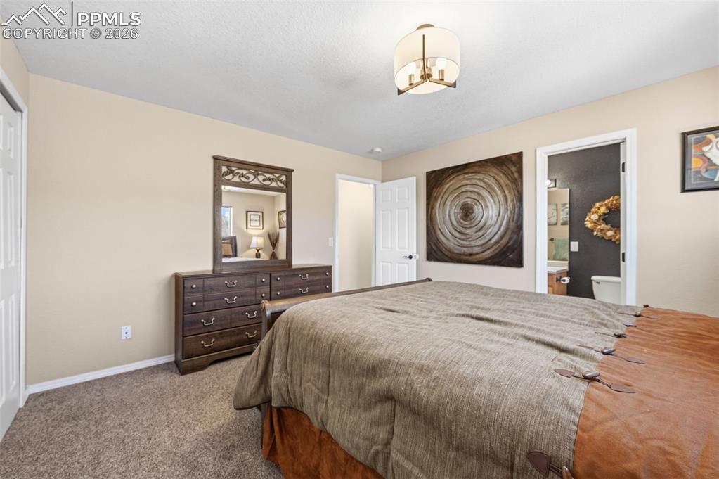 Image 17 of 36: Upper level primary bedroom