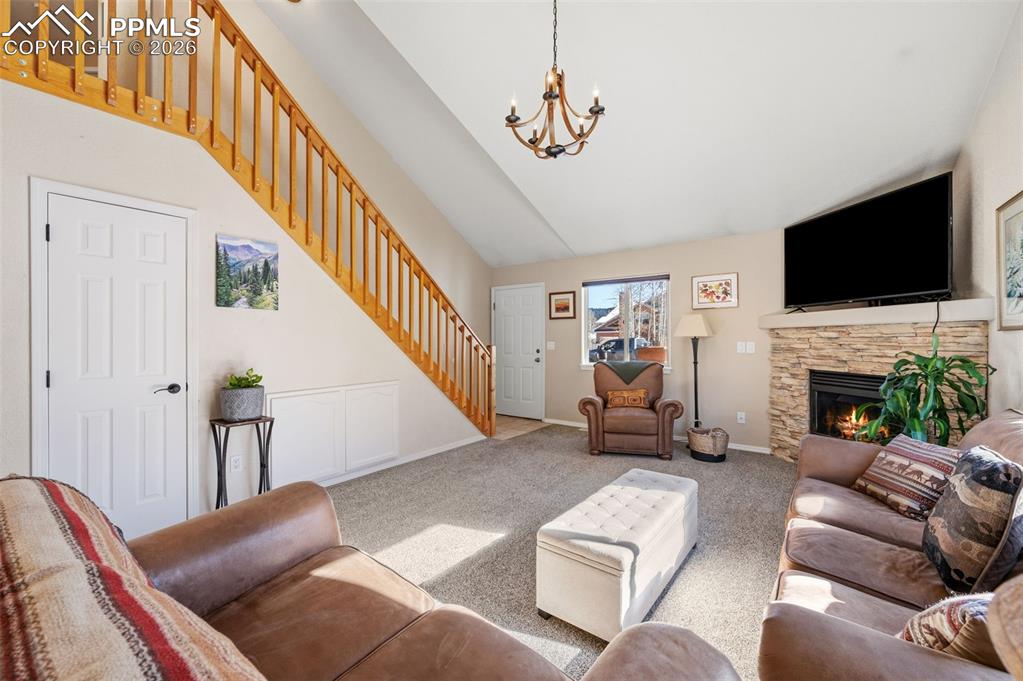 Image 8 of 36: Main level living room with vaulted ceilings