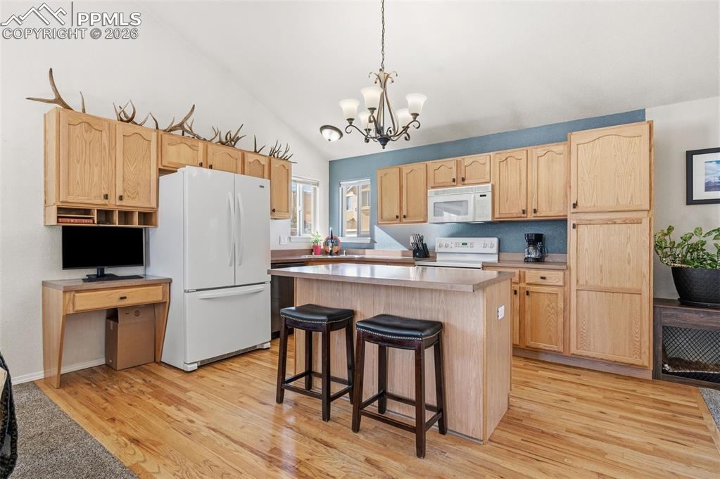 Image 9 of 36: Main level kitchen with island