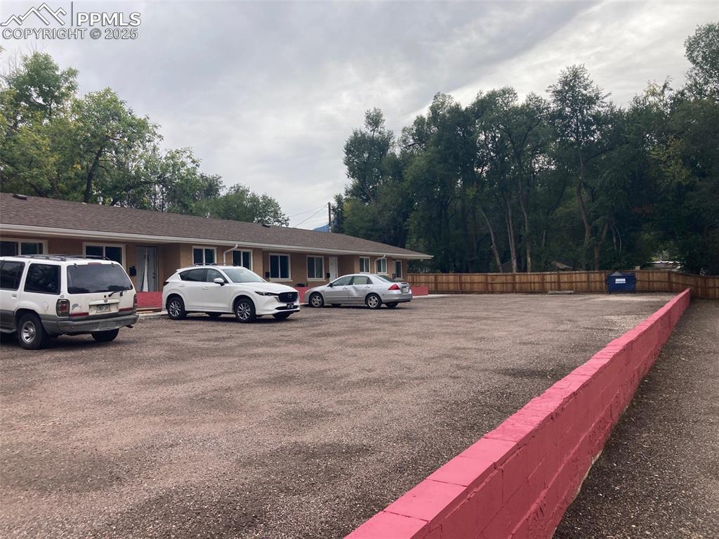 Image 16 of 26: View of uncovered parking lot