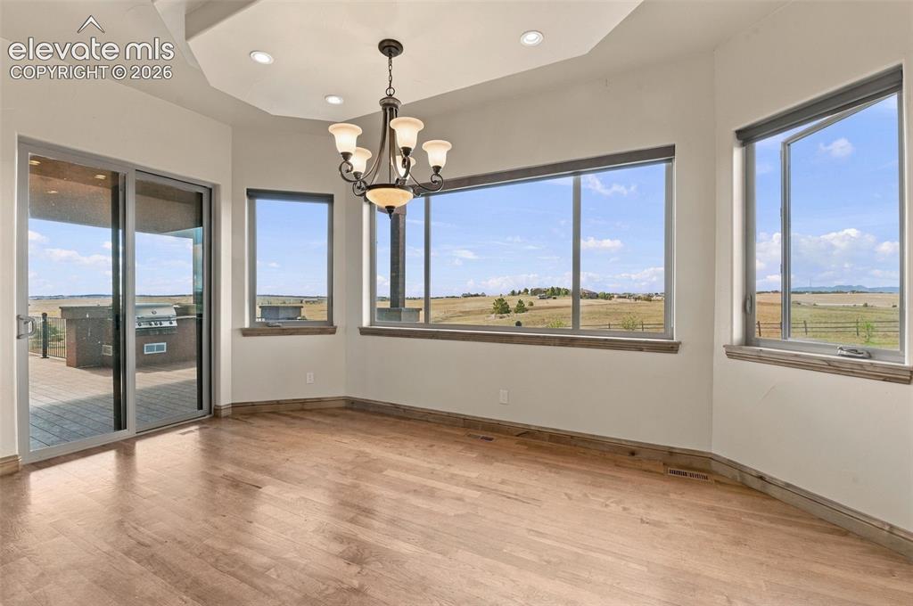 Image 11 of 50: Dining area with walk out