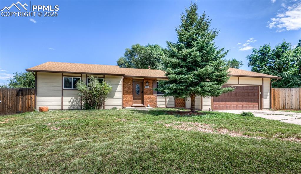 Caption: Single story home with an attached garage, roof with shingles, concrete driveway, and brick siding