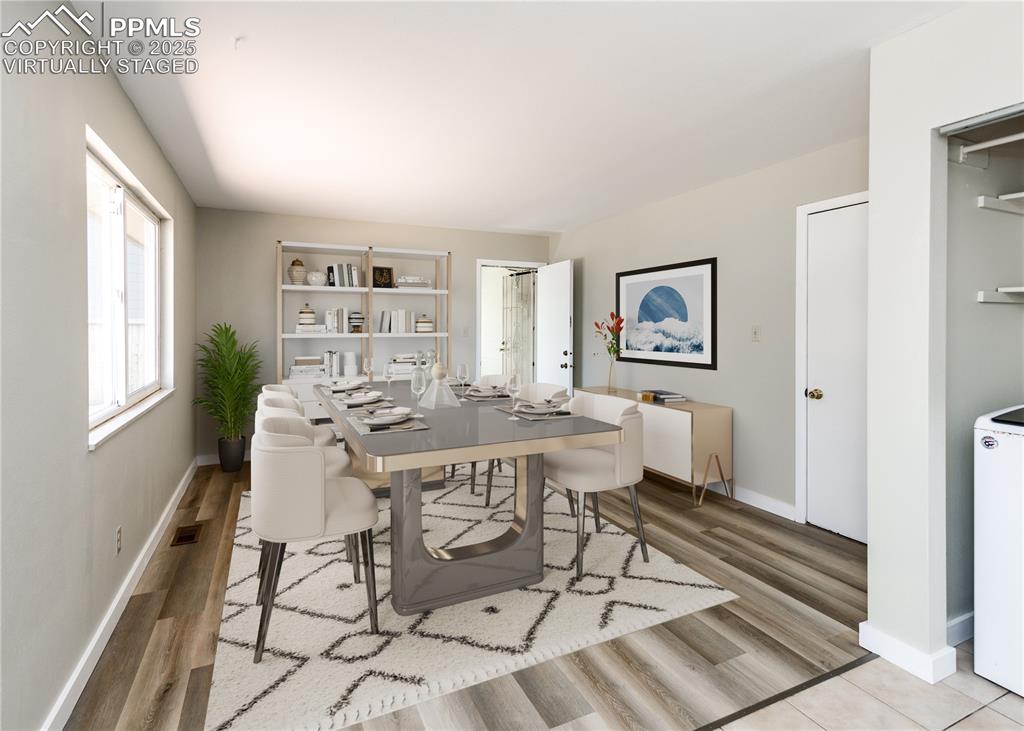 Image 22 of 48: Dining area with washer / clothes dryer and light wood finished floors. vir