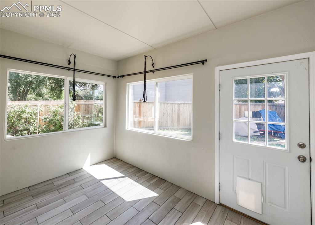 Image 27 of 48: Unfurnished sunroom with healthy amount of natural light