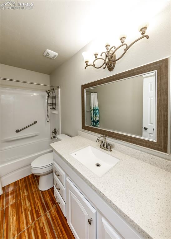 Image 41 of 48: Bathroom featuring vanity and shower / tub combo with curtain