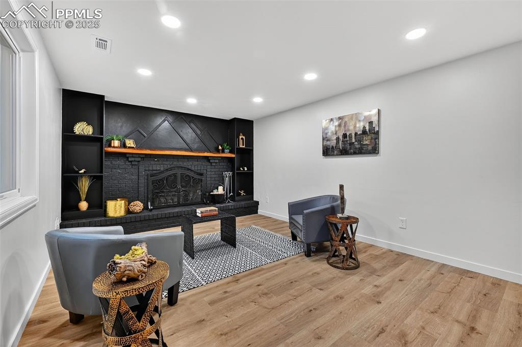 Image 7 of 48: With wood burning fireplace and walk-out to deck