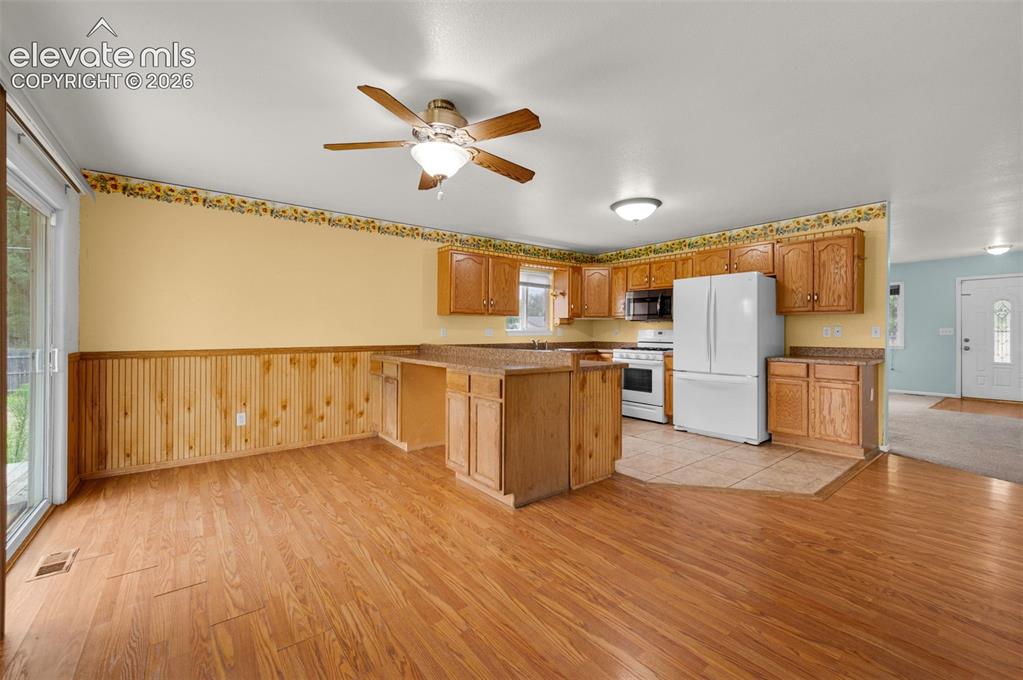 Image 12 of 29: Huge kitchen and dining area