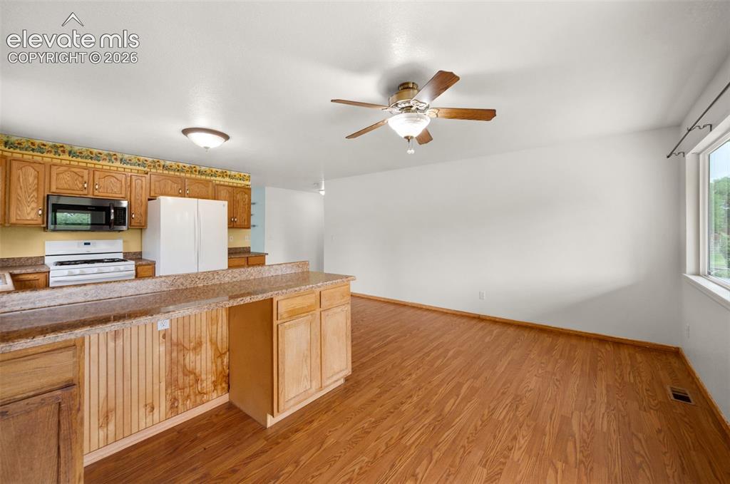 Image 16 of 29: Huge kitchen and dining area