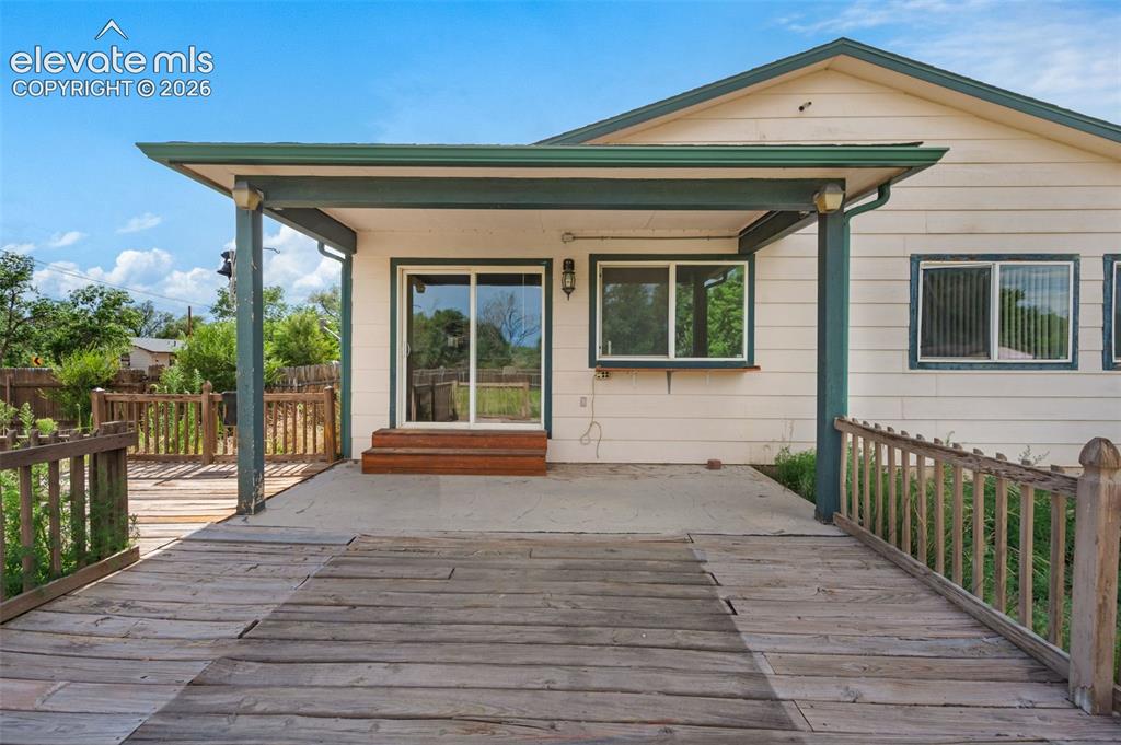 Image 27 of 29: Large wooden back deck