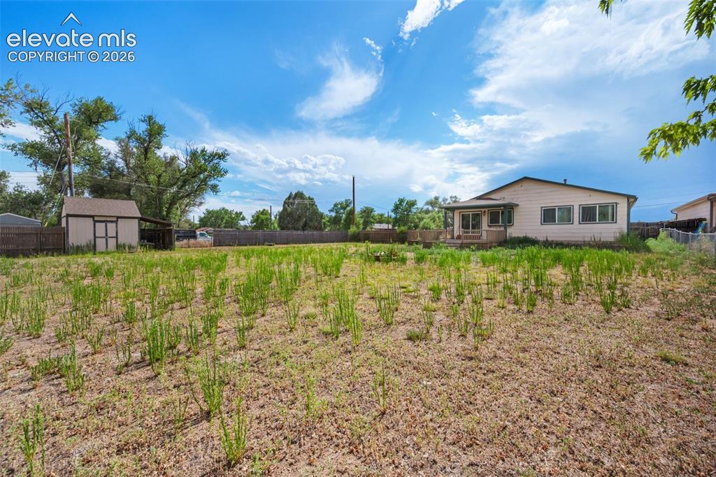 Image 28 of 29: RV parking!  Nearly 1/23 acre with cattle gate access!