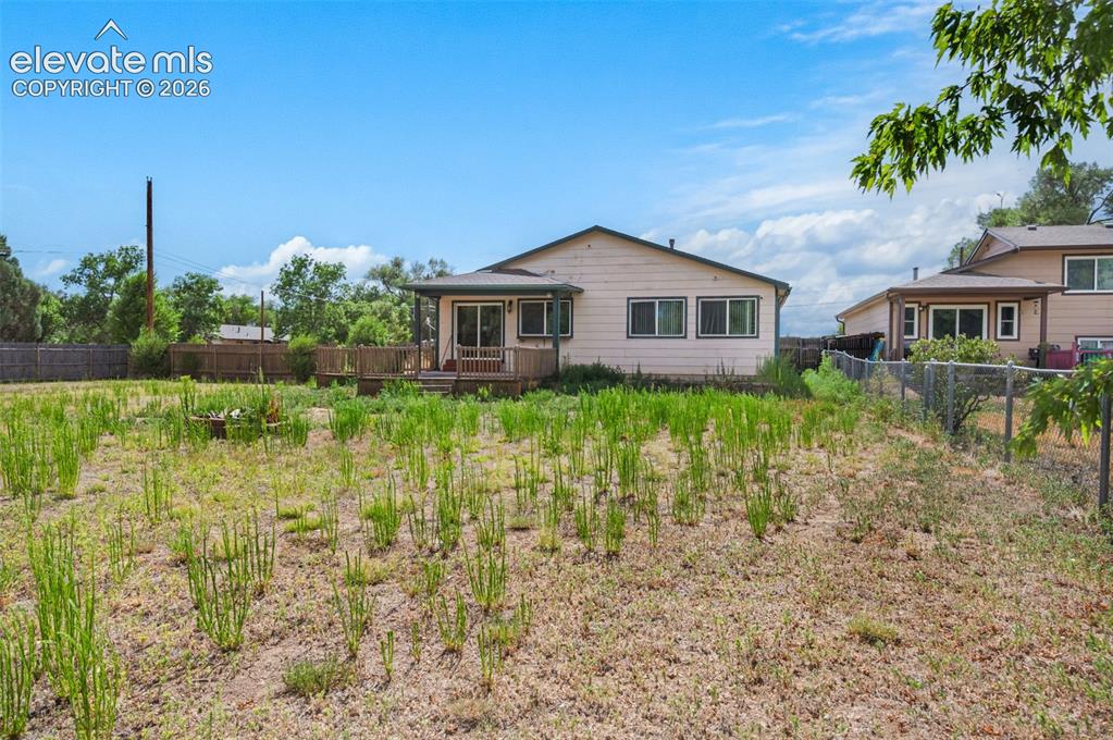 Image 29 of 29: RV parking!  Nearly 1/23 acre with cattle gate access!