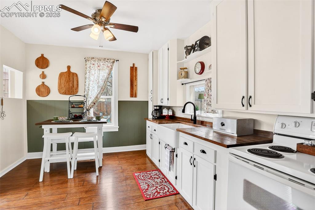 Image 12 of 41: Lovely updated kitchen with farm sink and custom cabinetry 