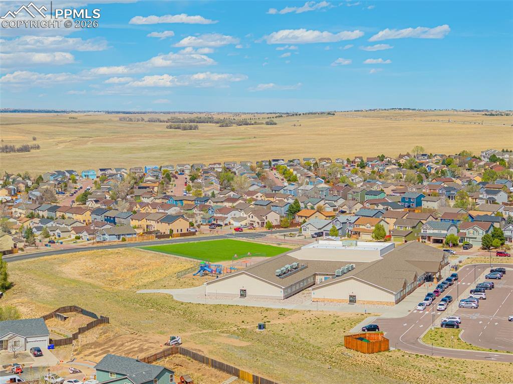 Image 24 of 29: Expansive aerial view showcasing a residential neighborhood with surroundin