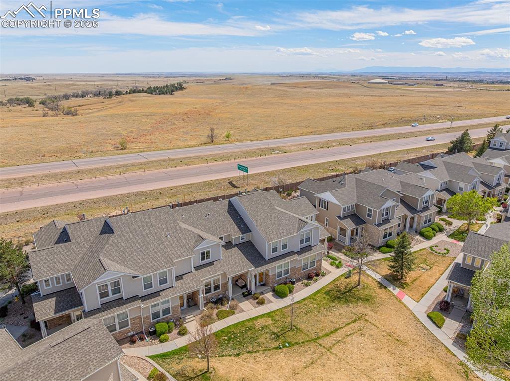Image 29 of 29: Residential development featuring multi-story townhomes with dormer windows