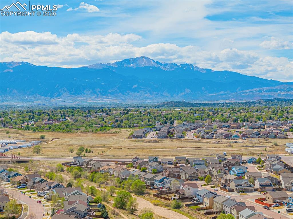 Image 4 of 29: Expansive mountain range backdrop framing a residential community
