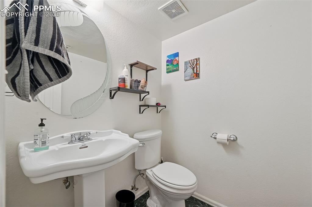 Image 20 of 27: Bathroom with toilet and baseboards