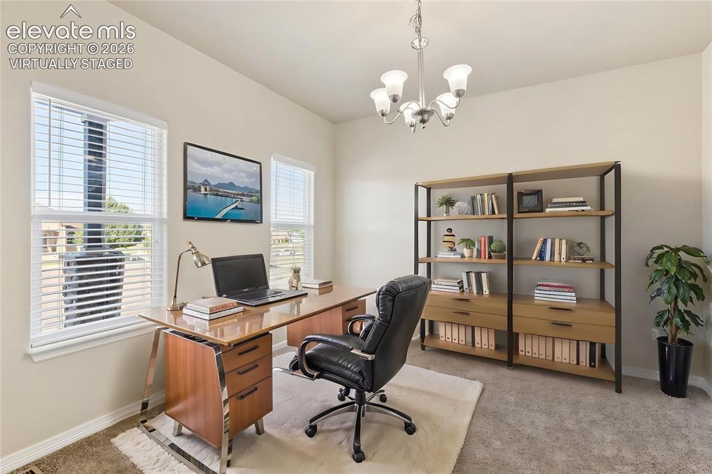 Image 12 of 46: Virtually staged.  Bonus room just to the left of the entrance.