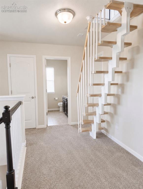Image 25 of 46: Upstairs landing with attic access.