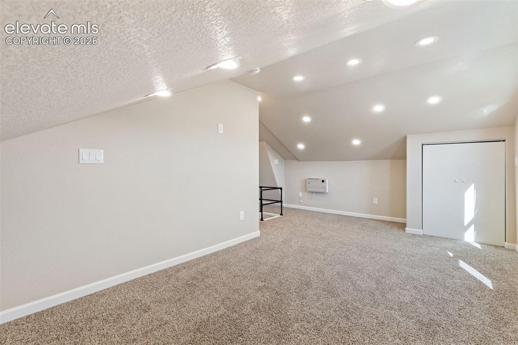Image 28 of 46: Finished attic space.