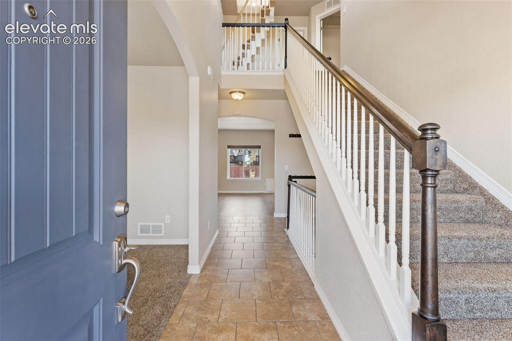 Image 3 of 46: Vaulted ceilings greet you as you enter