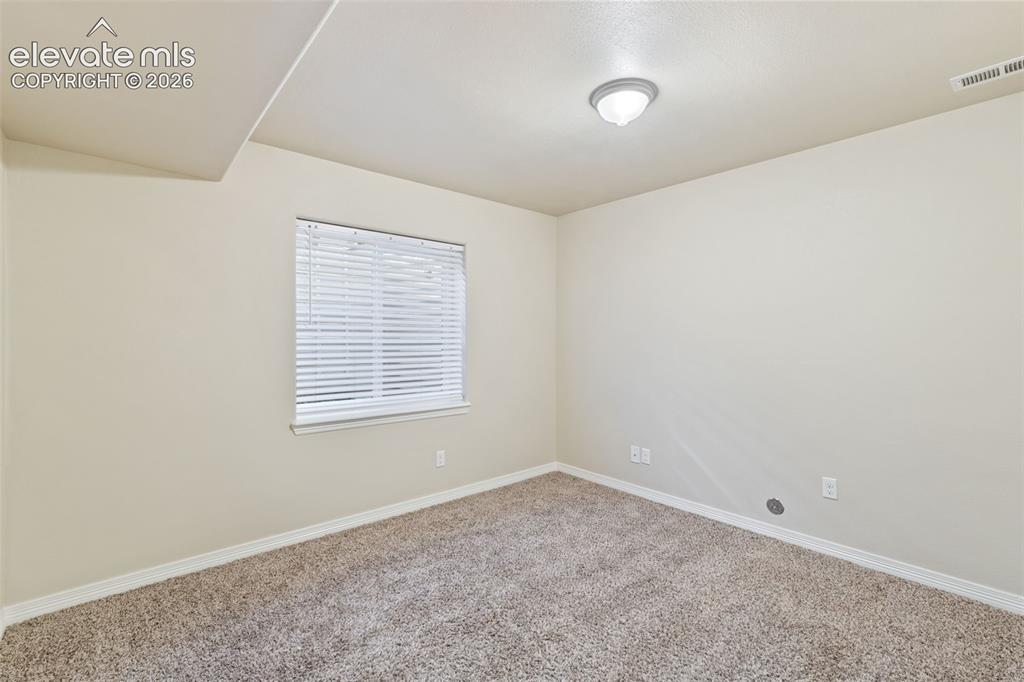 Image 31 of 46: 5th bedroom located in the basement