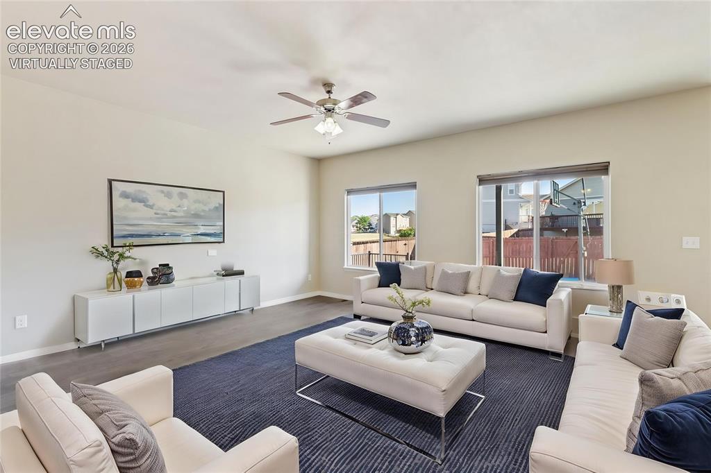 Image 7 of 46: Virtually staged.  Open concept living room and kitchen on main level with 