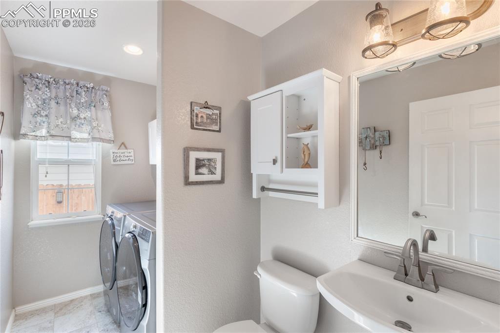 Image 14 of 43: Half Bath & Laundry