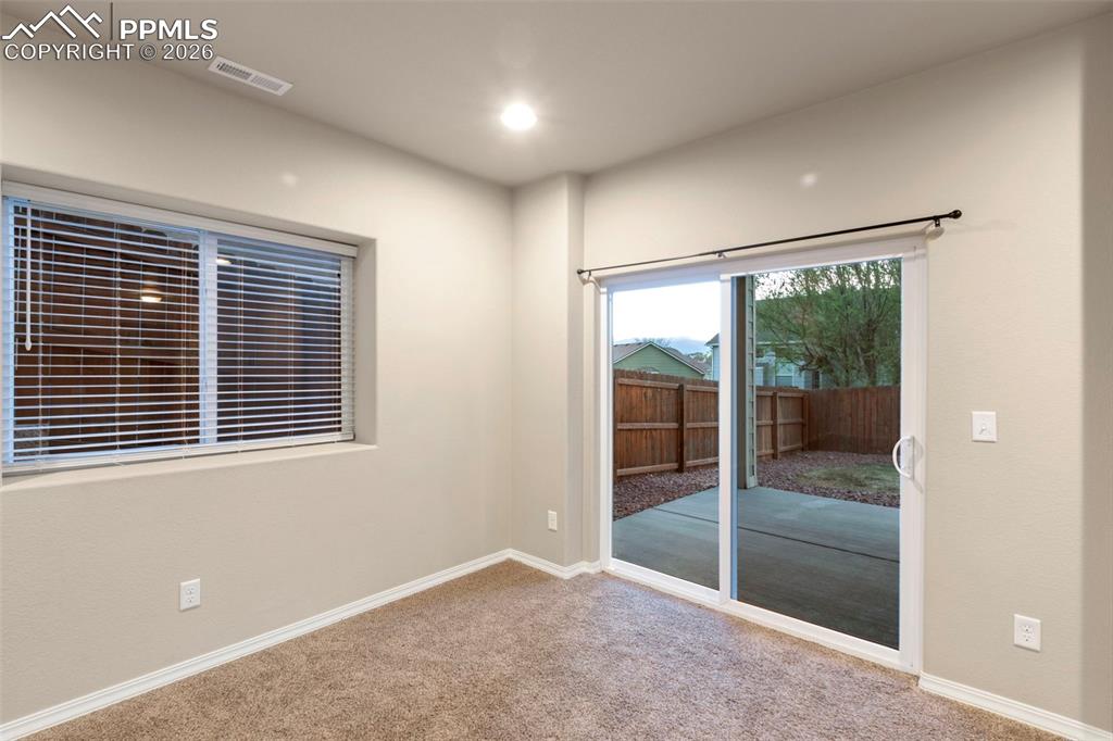 Image 25 of 36: Great walkout to another covered patio!