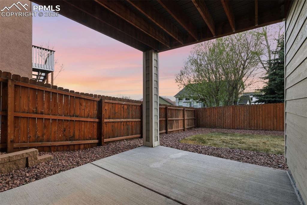 Image 33 of 36: Covered patio from basement walkout.