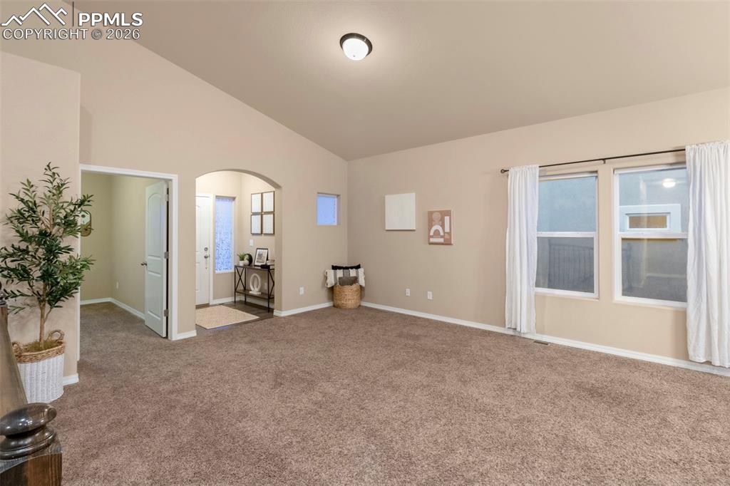 Image 6 of 36: Main living with nice entry way.