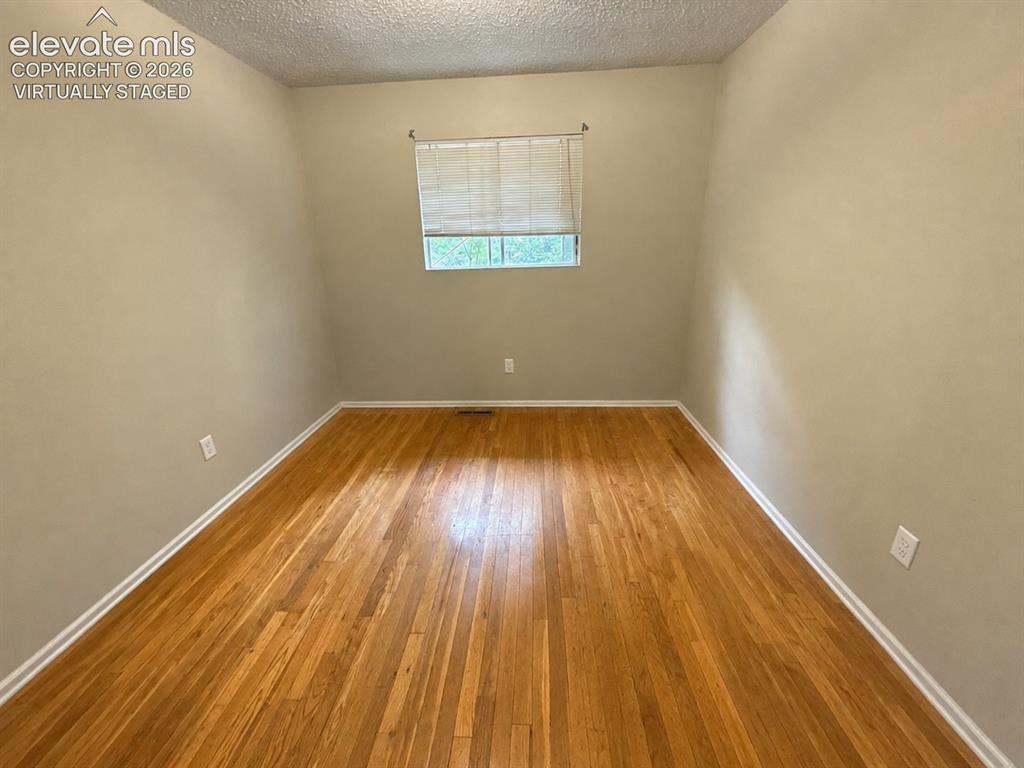 Image 16 of 27: Upstairs bedroom virtually staged to show it empty