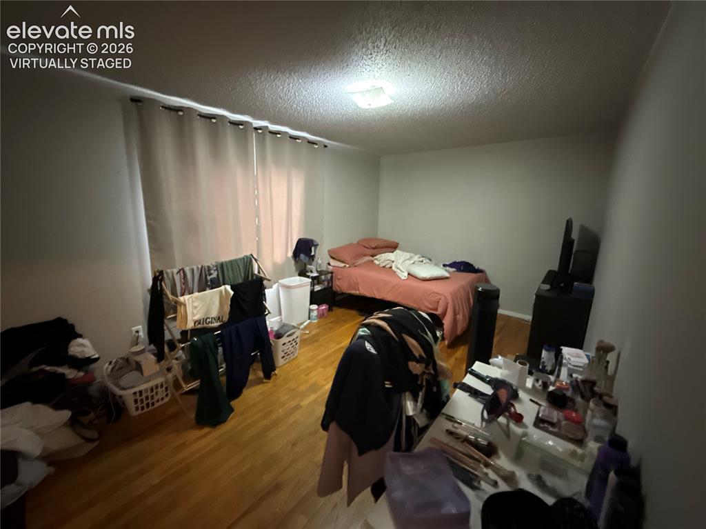 Image 19 of 27: Upstairs bathroom virtually staged to show less cluttered