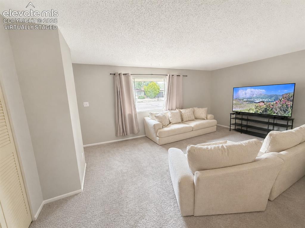 Image 2 of 27: VIrtually Staged to show the room decluttered 