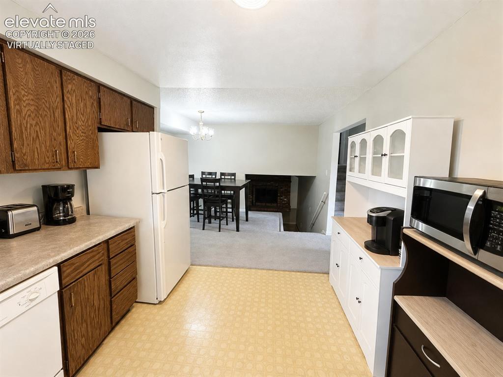 Image 4 of 27: Virtually staged to show the kitchen decluttered and in better light