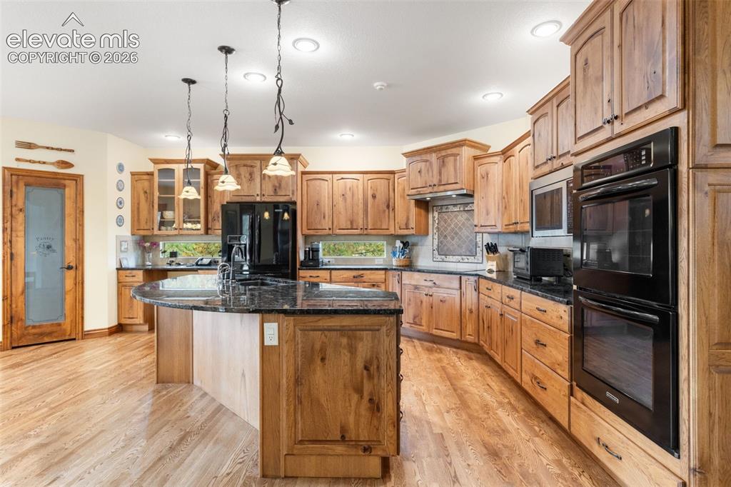 Image 11 of 47: Kitchen and view of pantry
