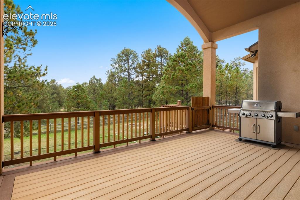 Image 14 of 47: Covered deck in the rear of the house
