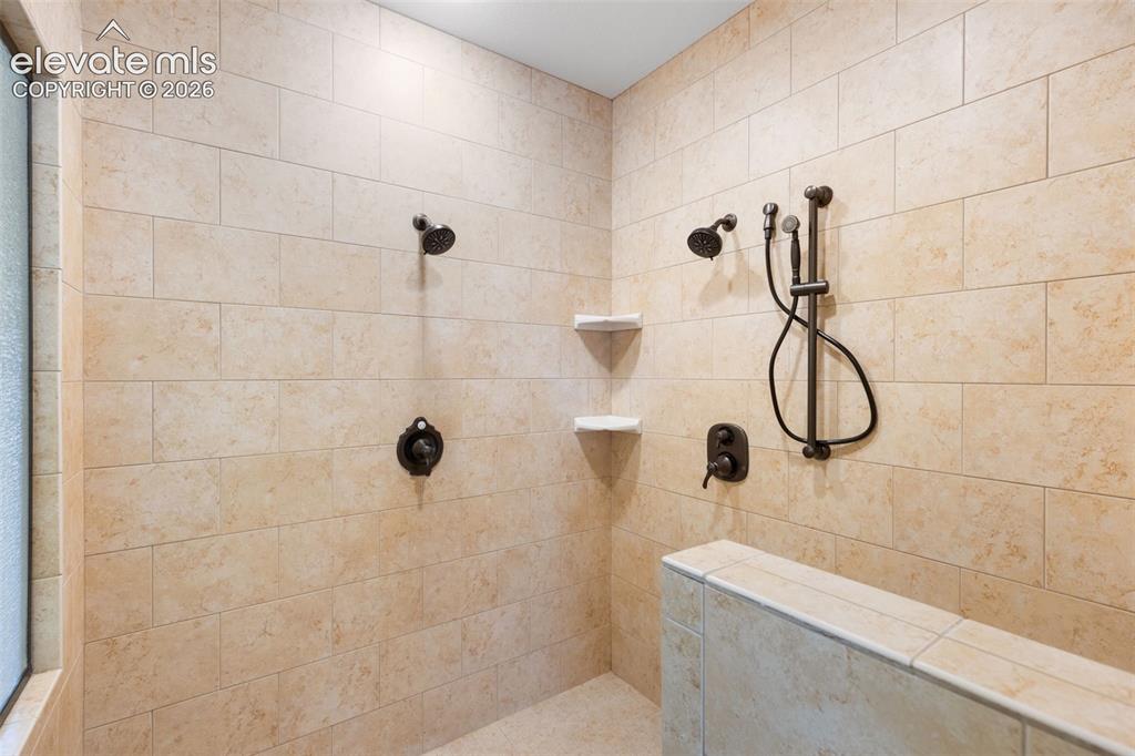 Image 22 of 47: Walk-in shower primary bedroom