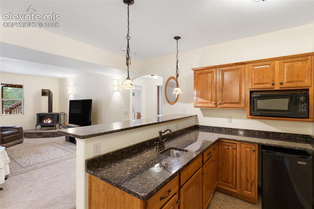 Image 25 of 47: Wet Bar in the basement