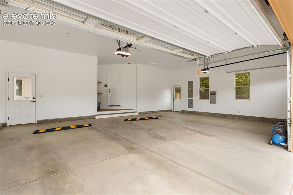 Image 34 of 47: Oversized attached 3 car garage