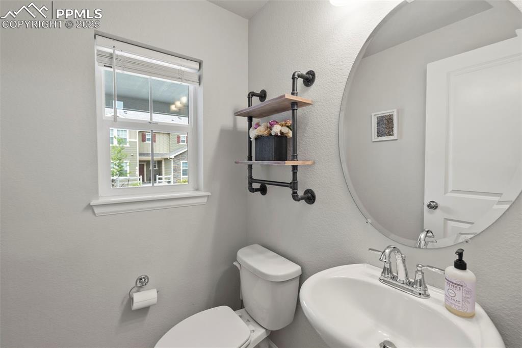 Image 12 of 24: Bathroom featuring toilet and a sink