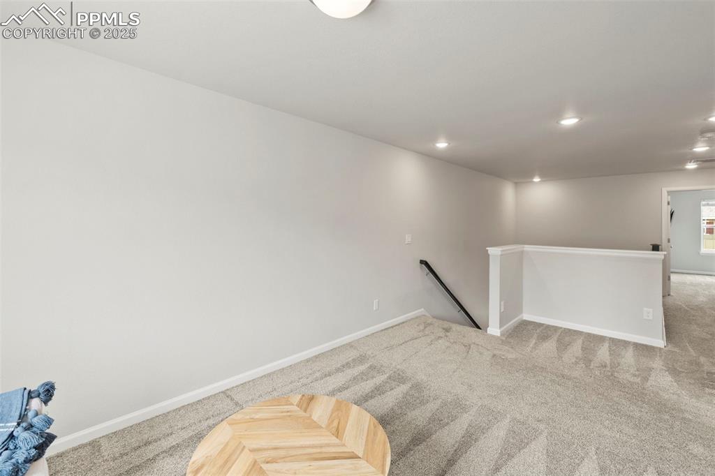 Image 14 of 24: Empty room featuring carpet floors and recessed lighting