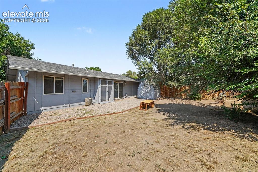 Image 19 of 19: Backyard with storage shed